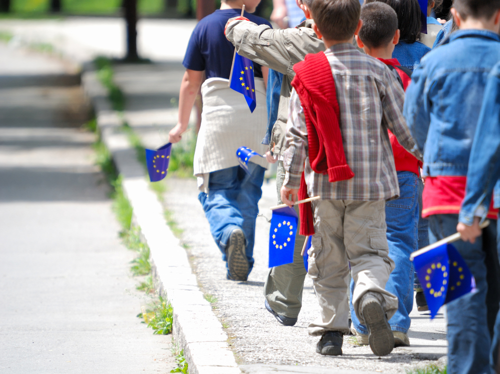 Childrens,Group,With,Eu,Flags,Walking,Ahead
